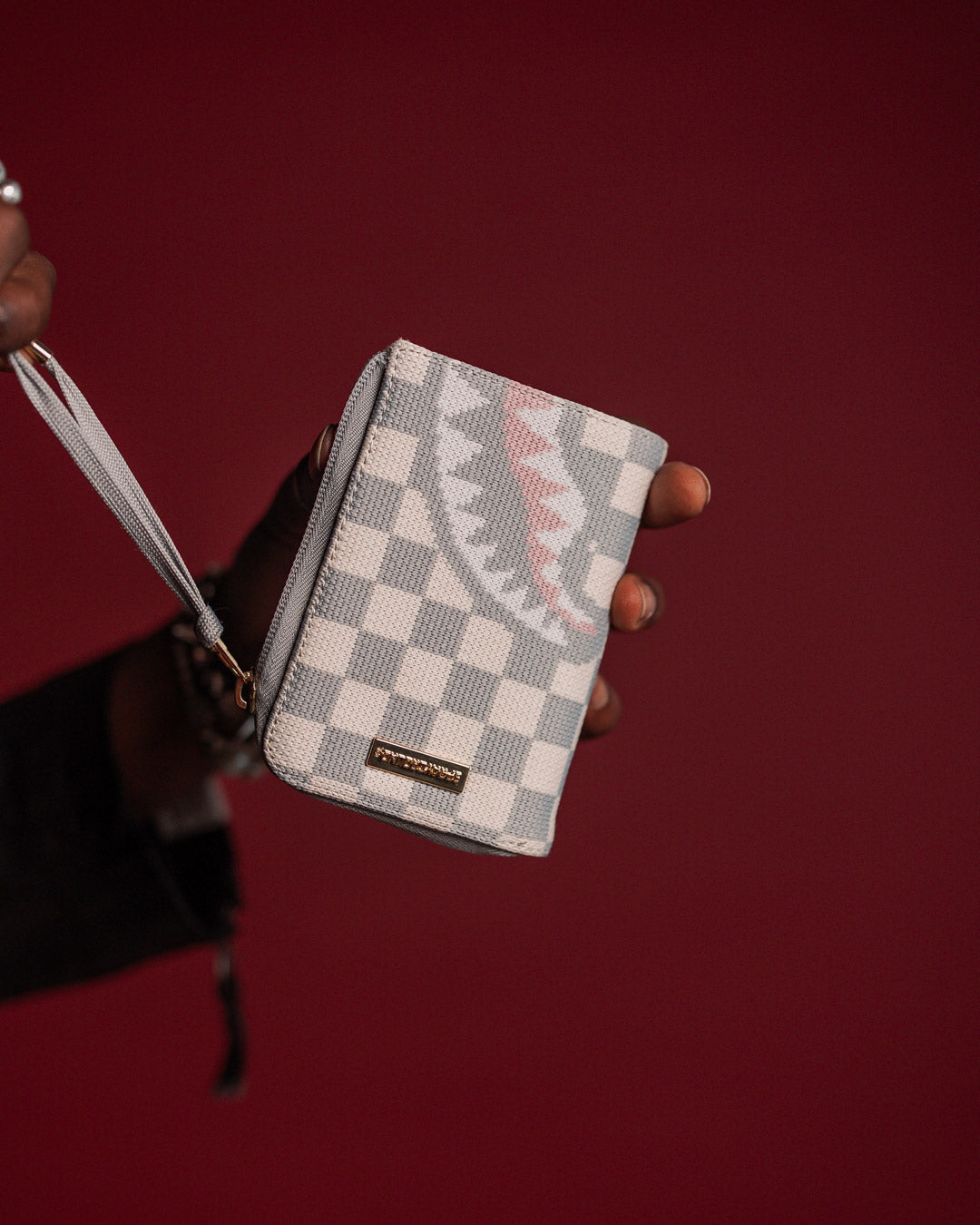 Front view of Sprayground Knit Sharks wallet open, displaying card slots and Paris-themed design.