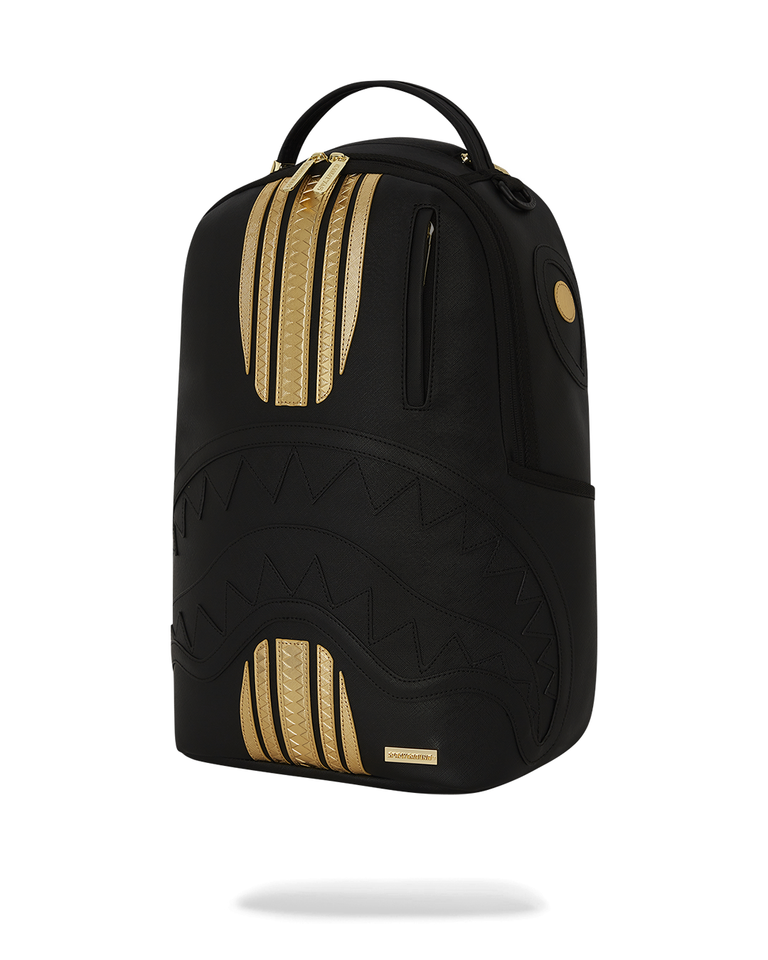 Close-up of the gold zipper and metal Sprayground Authentic badge on the backpack.