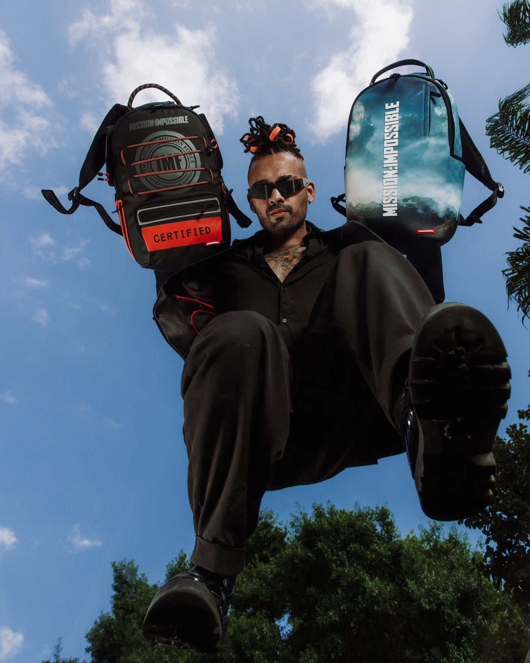 Front view of the mission impossible backpack showing bold 3D logo design