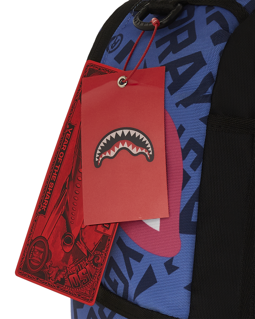 Front view of the pink Sprayground backpack showcasing Meg Shark Mouth graphic and gold zippers