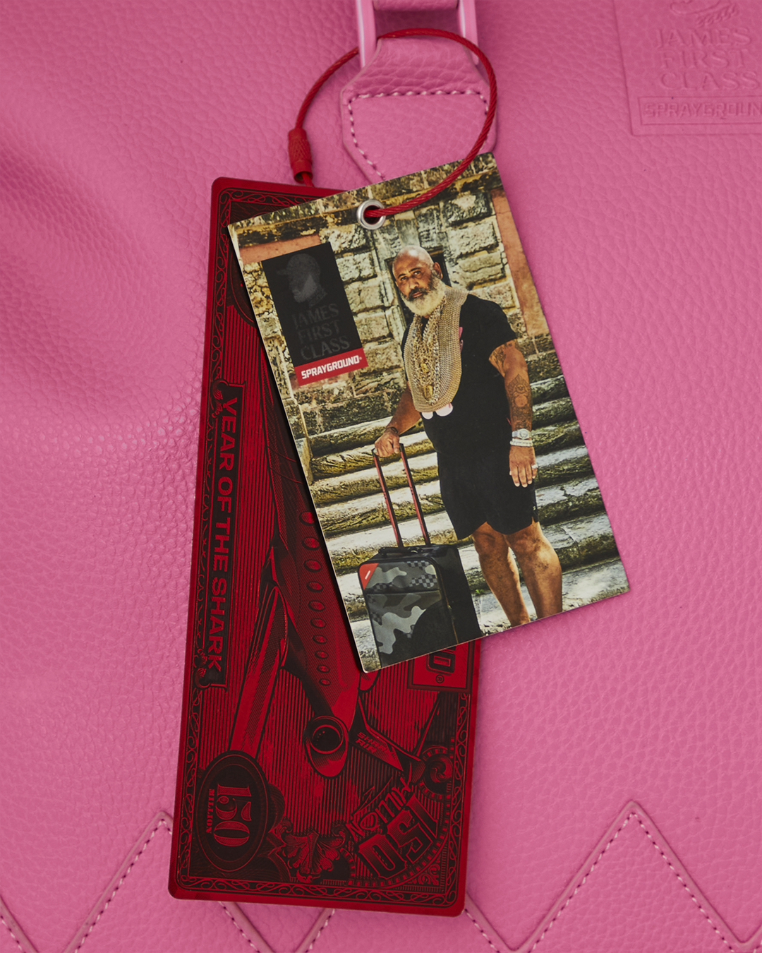 First Class Handbag on display, highlighting enamel details.