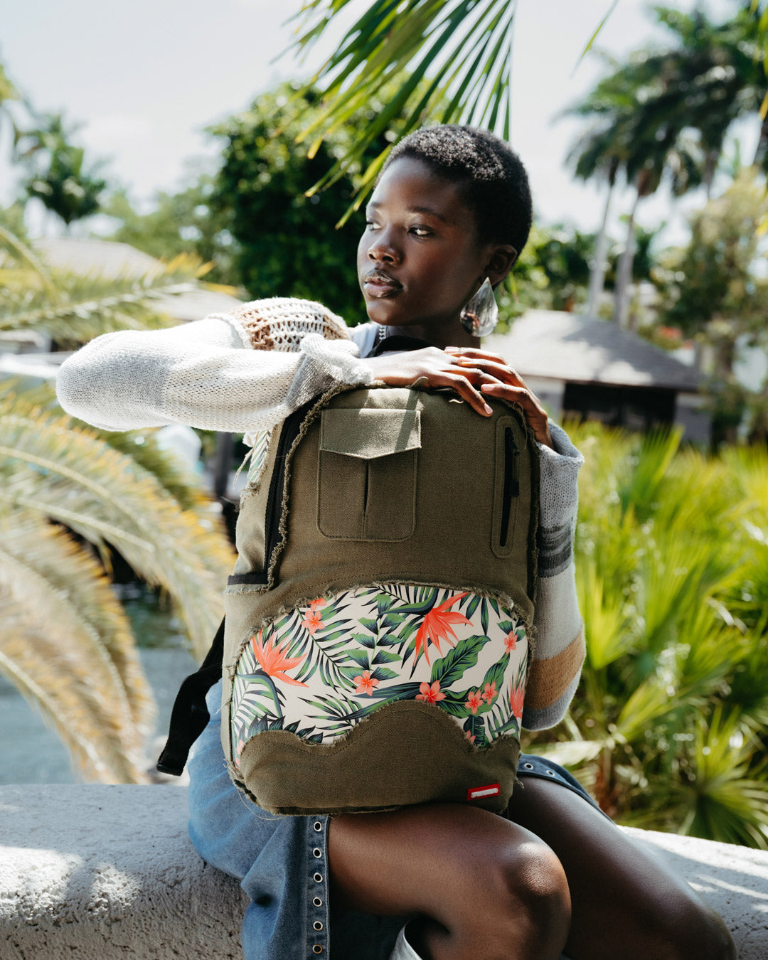 Side view of small tactical backpack worn over shoulder, ideal for urban travel