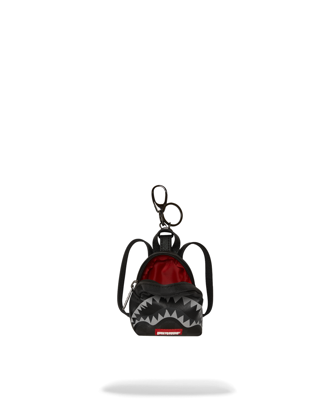 Paris-themed shark keychain on a denim jacket pocket