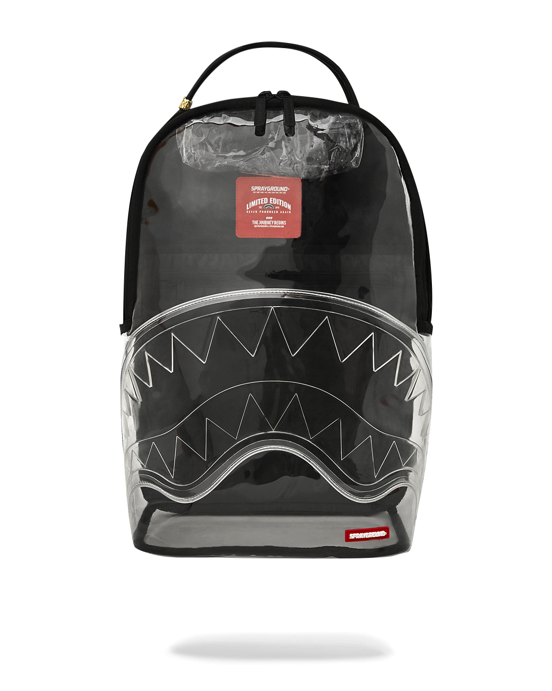 Front view of the clear sprayground backpack with shark design and removable bear accessory