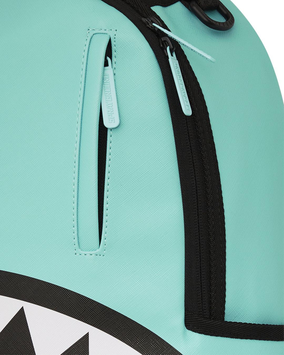 Shark Central backpack open, displaying interior velour laptop compartment and organizer pockets.