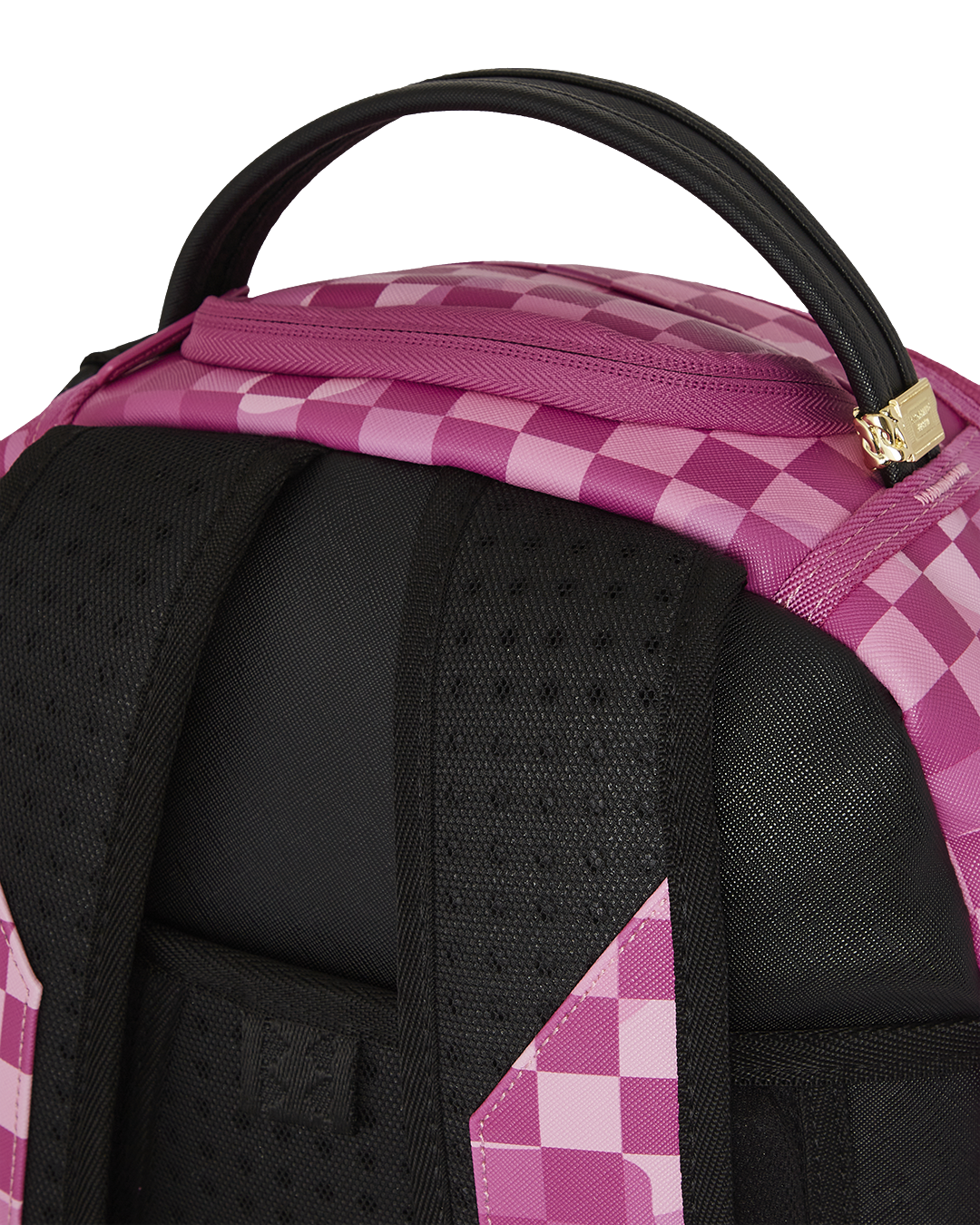Black leather backpack for men displayed on a modern workspace desk