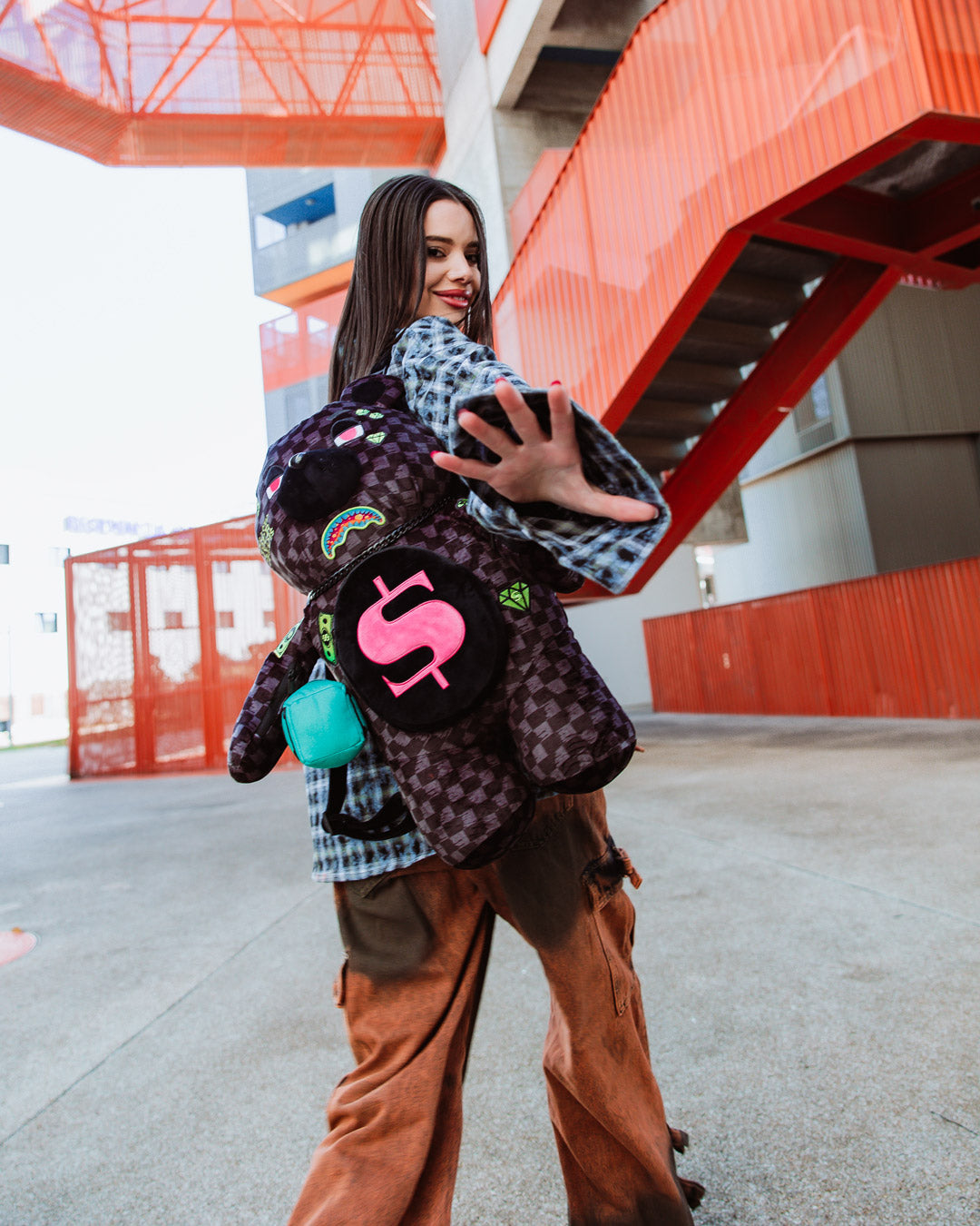 Front-facing view of sprayground teddy bear backpack limited edition featuring slime green accents.