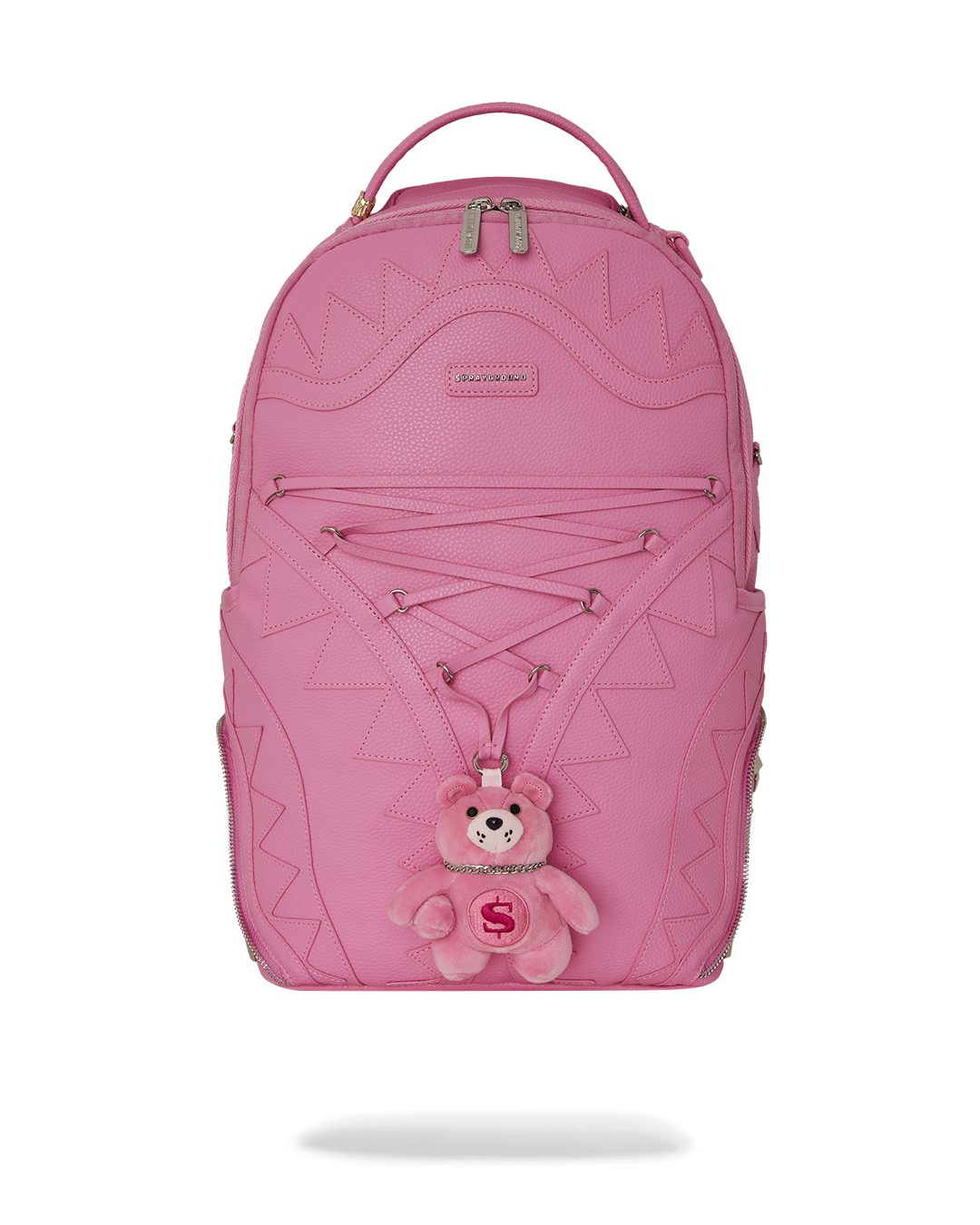 Faux leather backpack with decorative zipper detailing and plush bear hanging from the center Faux leather backpack with decorative zipper detailing and plush bear hanging from the center