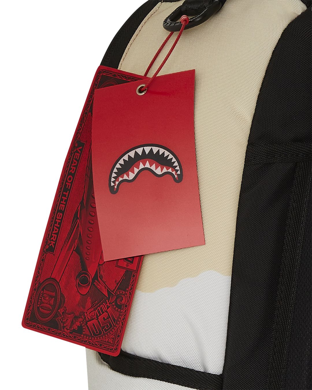 Front view of the designer backpack showing gold zippers and velour compartment