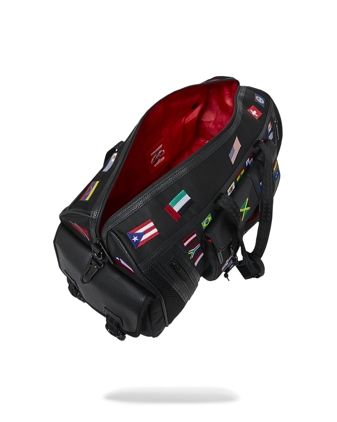 Front view of the tactical duffle bag with flag patches and embossed sharkmouth design