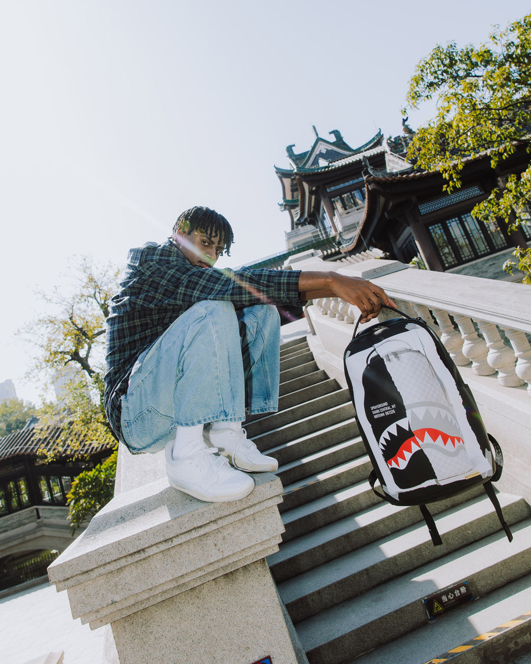 Close-up of Sprayground shark backpack’s Paris-inspired shark graphic.