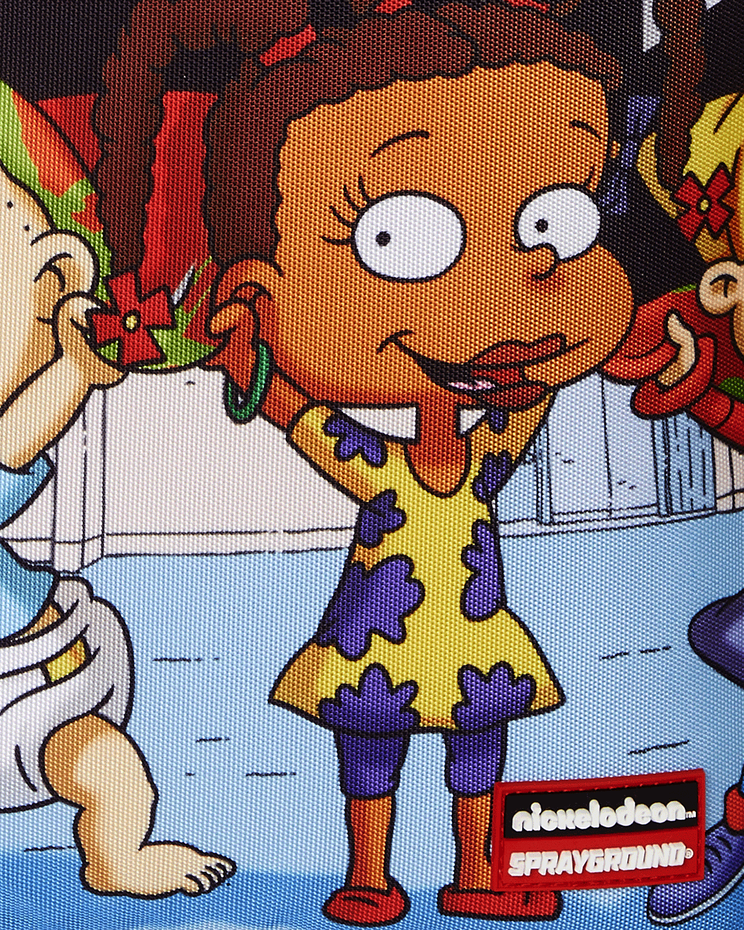 Stylish Rugrats travelers backpack with gold zippers and unique design features.