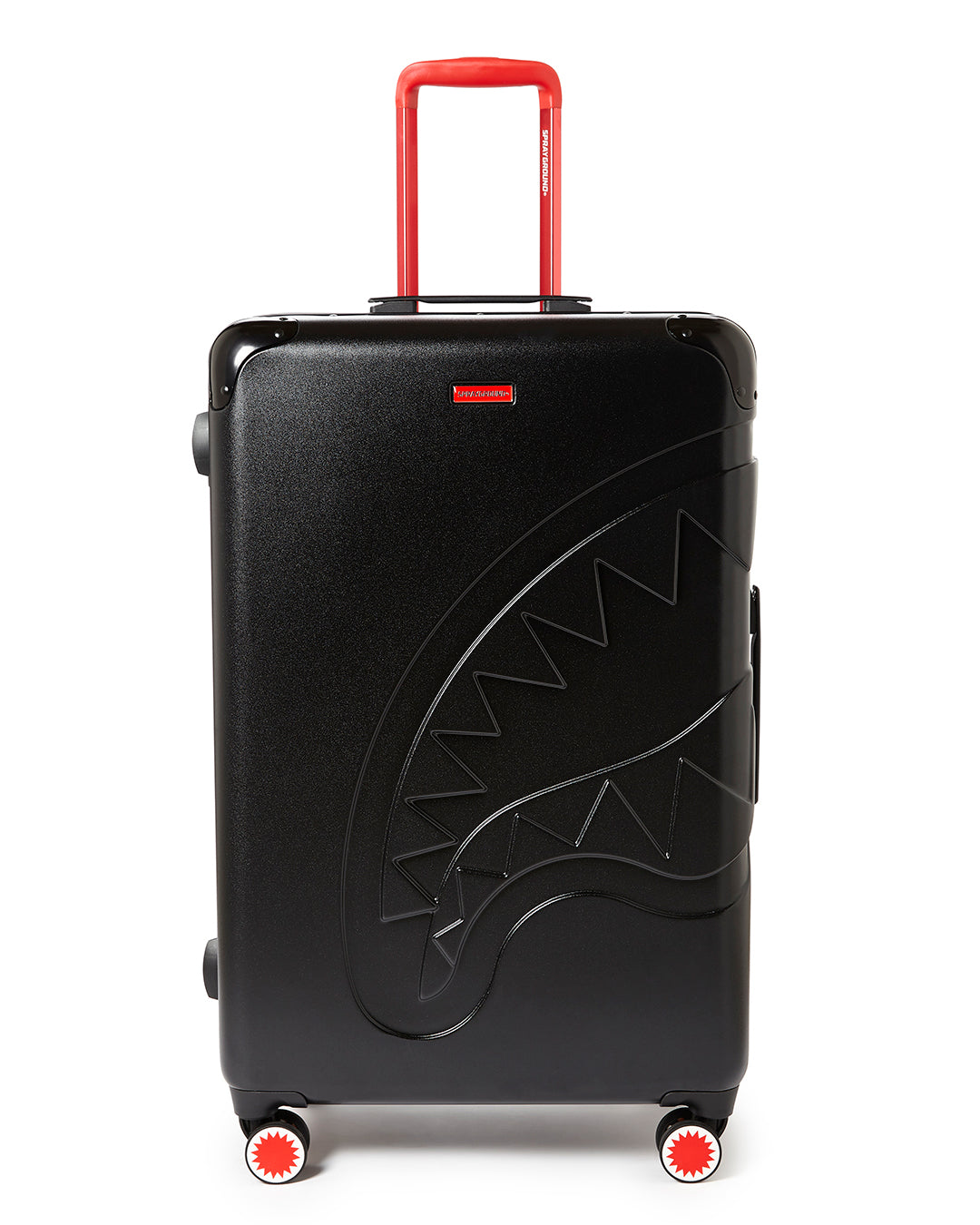 Sharkitecture polycarbonate luggage set in airport setting