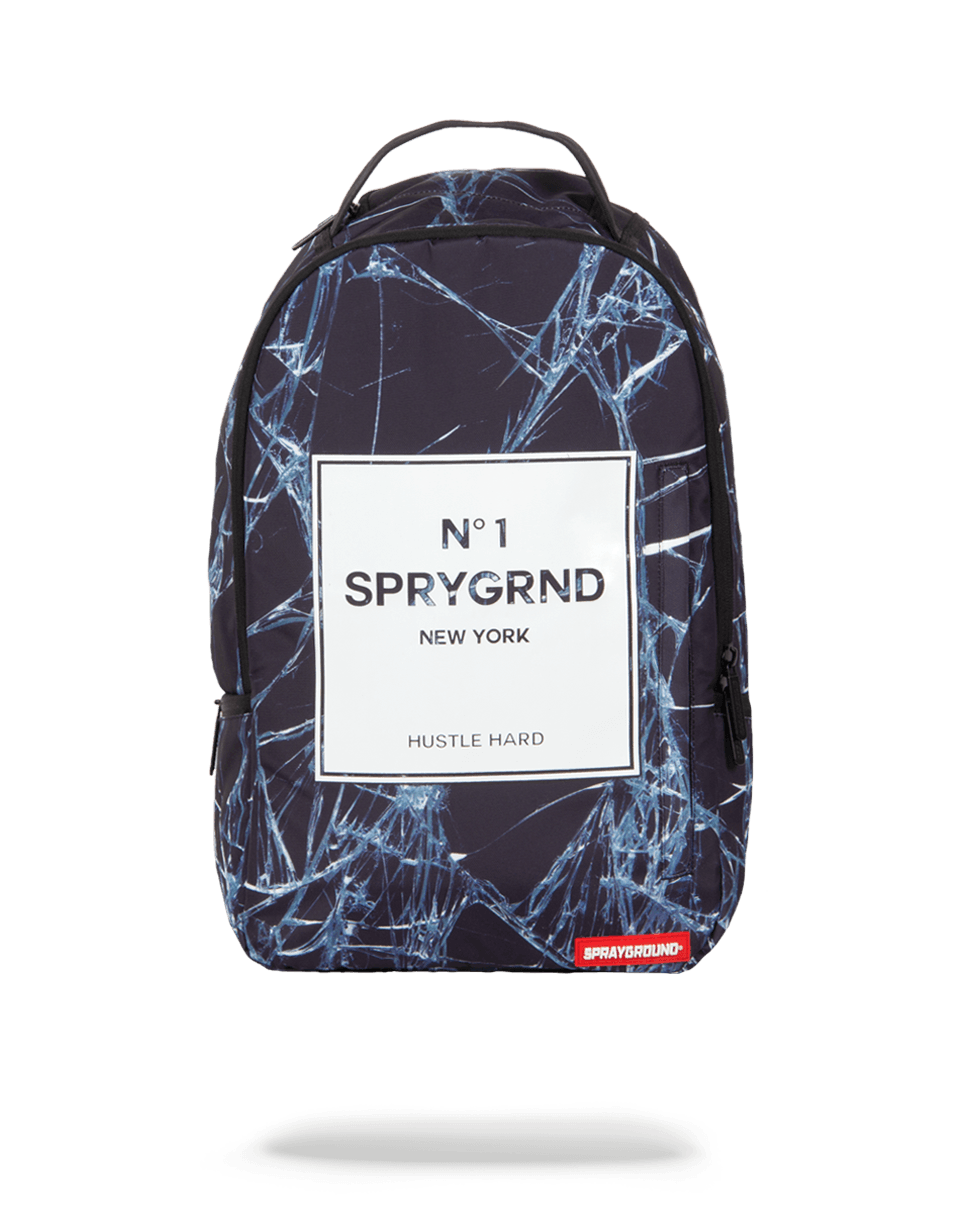 SpryGrnd backpack worn by a traveler in an urban setting, showcasing its sleek profile