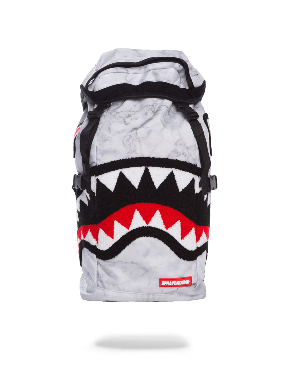 Marble streetwear backpack worn casually over one shoulder in urban setting