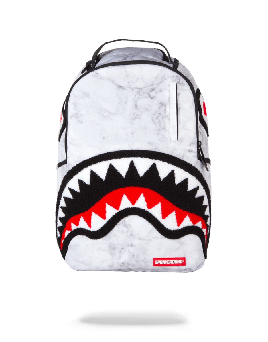 Front view of the white backpack showing marble finish and compact dimensions