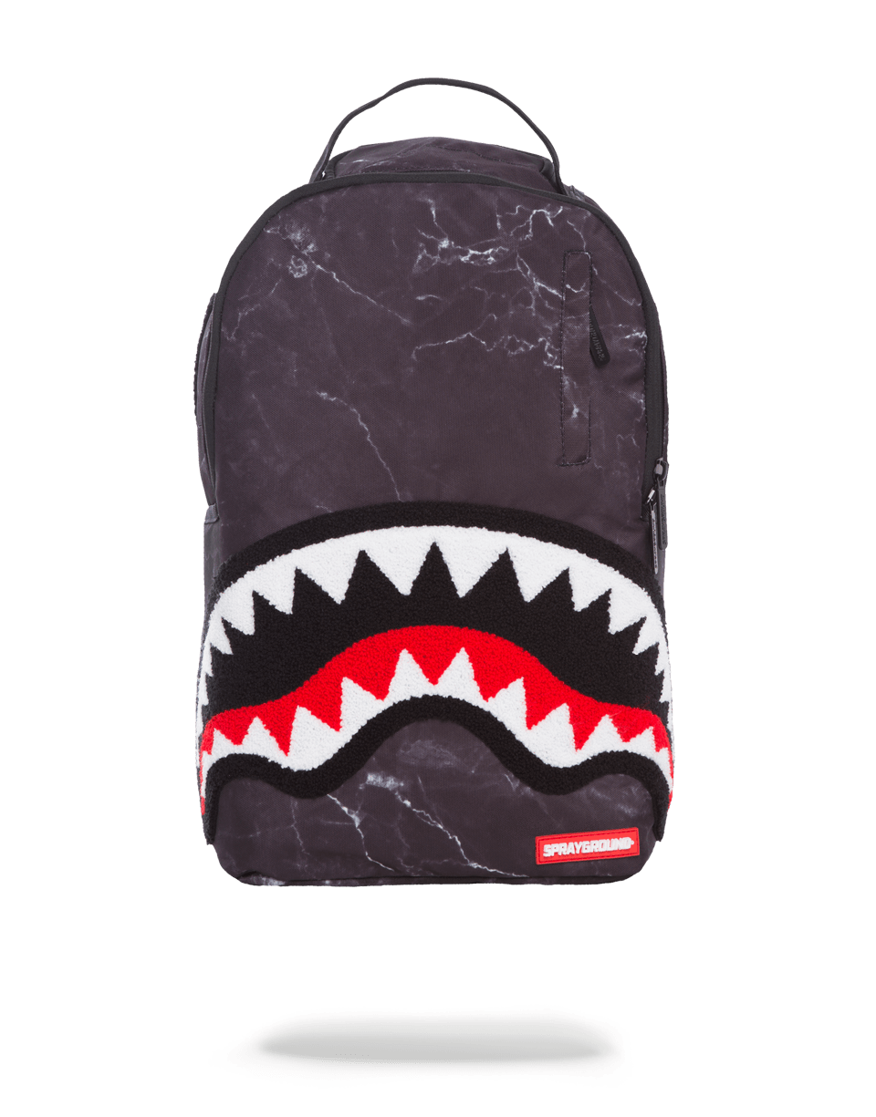 Black marble backpack open to show laptop compartment and organizer pockets