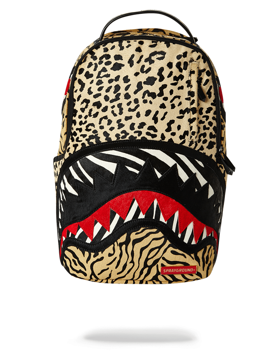 Front-facing view of the Safari Apex pony hair backpack on a rocky Colorado overlook