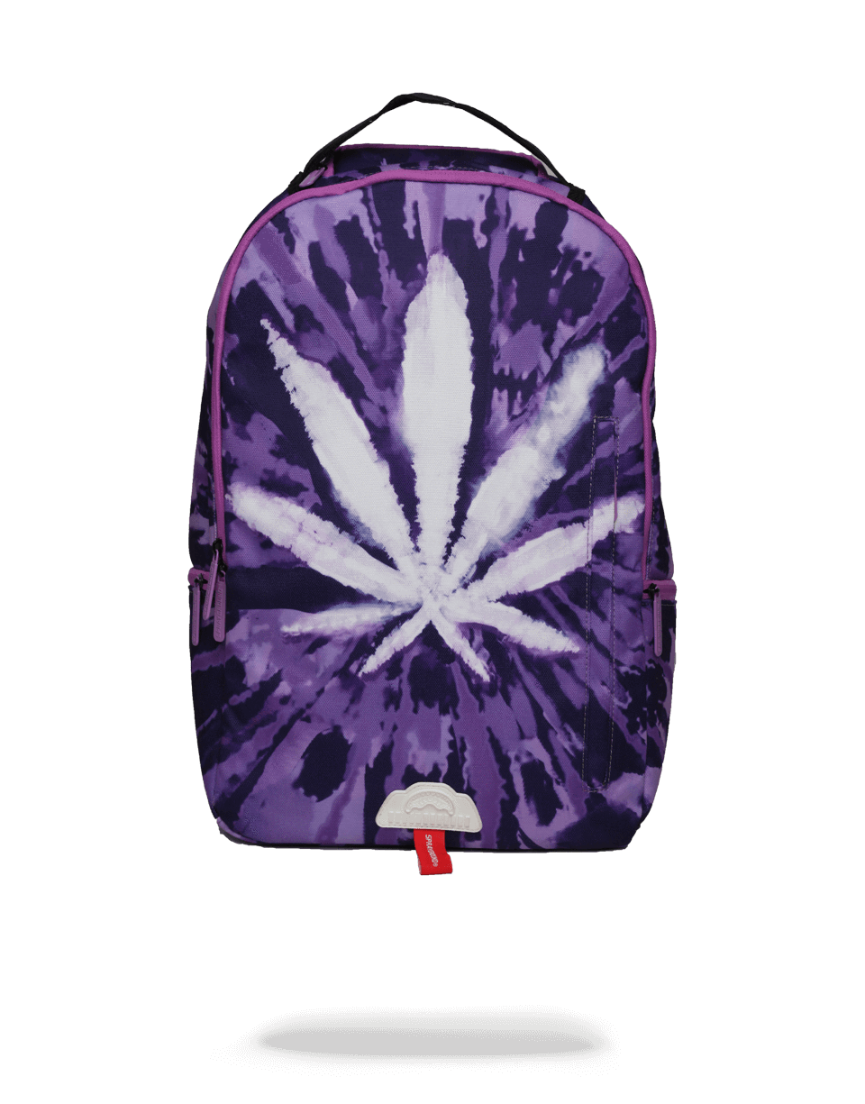 Tie dye weed backpack worn by a student on a sunny campus