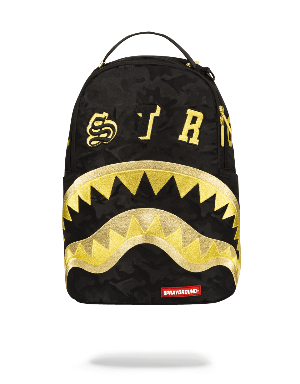 Gold camo Destroy Shark laptop backpack with ergonomic straps on display.