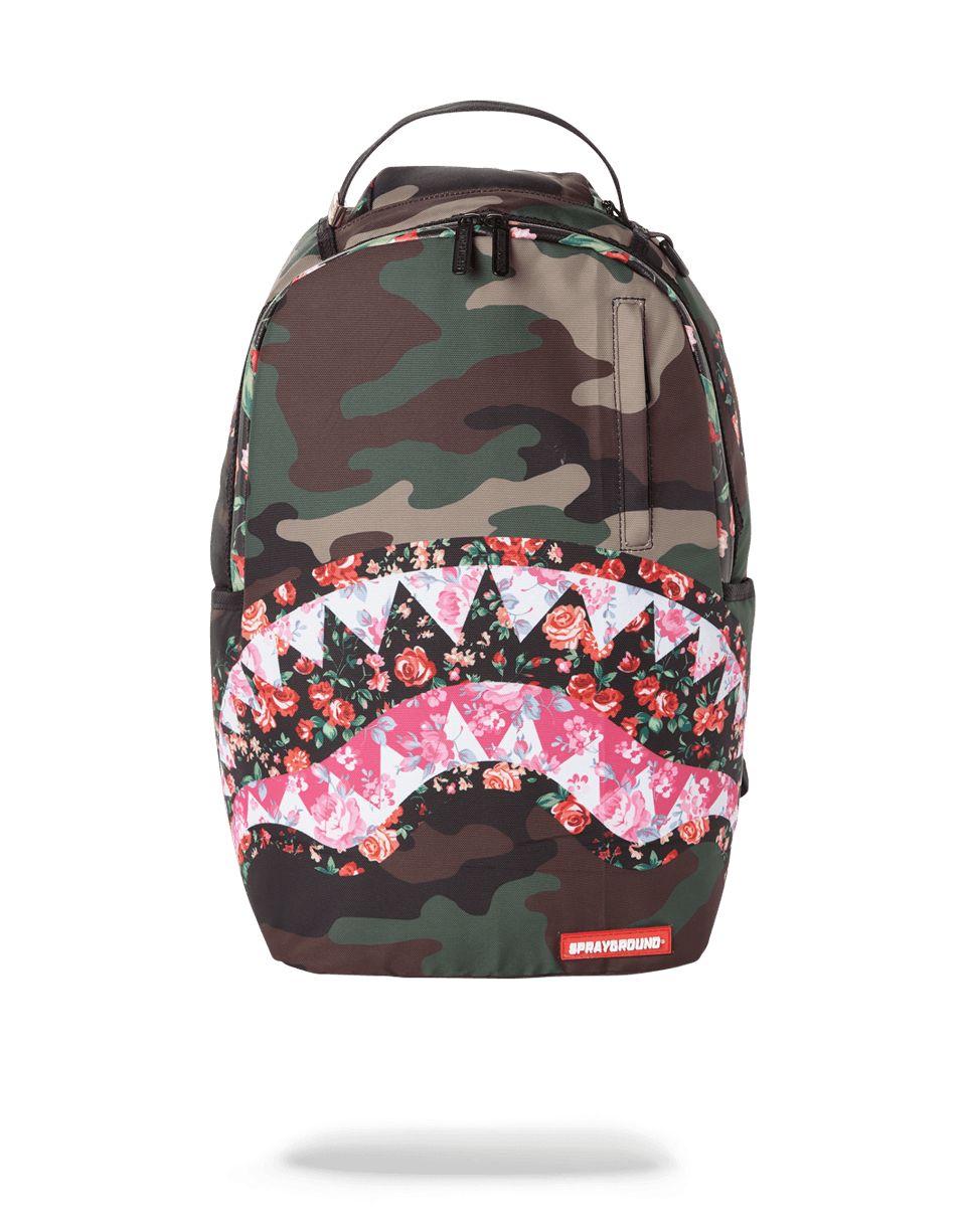 Sprayground backpack pink front view, highlighting the front zipper pocket and metal 'Sprayground Authentic' badge