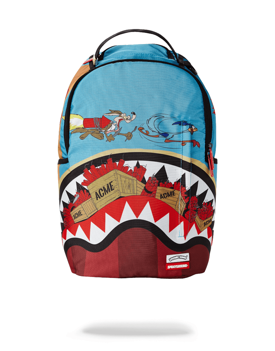 Coyote vs Roadrunner Shark Backpack front view in the park.