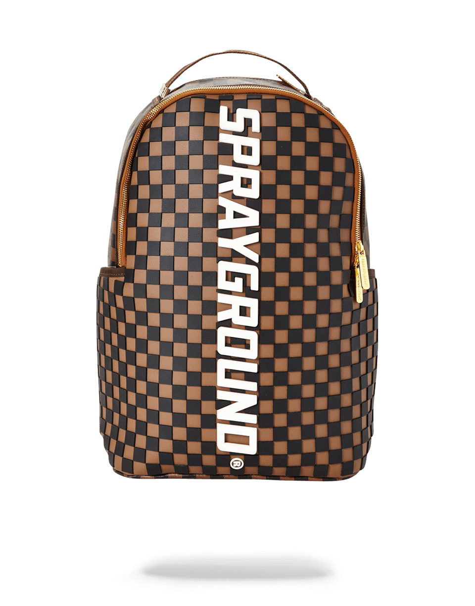 Sprayground backpack worn over shoulders, showing side pockets and padded straps.