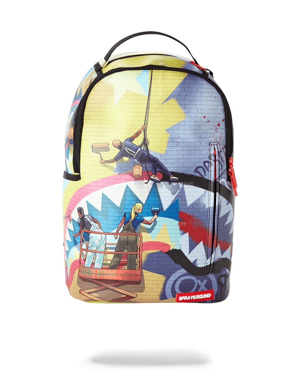 Sprayground Midnight Run backpack worn by a woman in a city setting
