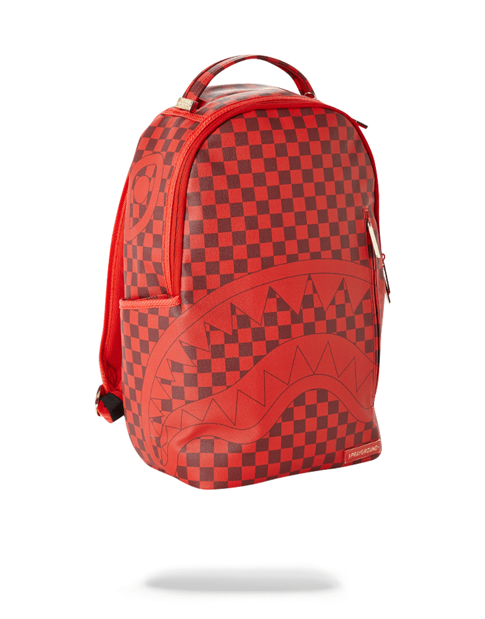 Sprayground Sharks in Paris backpack front view, showcasing red checkered pattern and zipper details