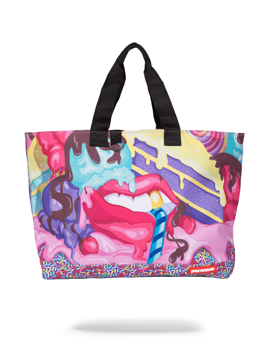 Front view of the large leather tote bag, showcasing its luxurious finish and exterior pockets.