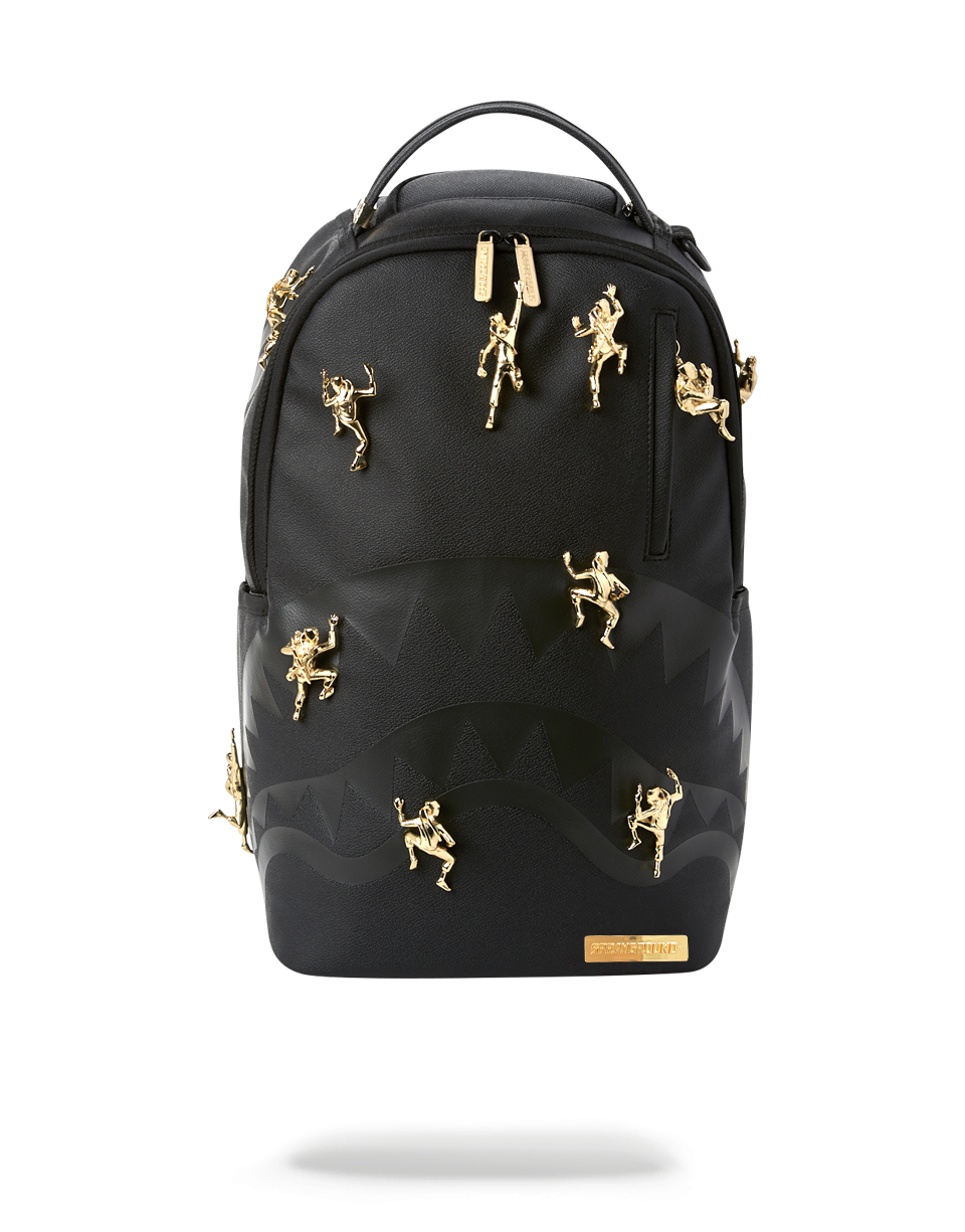 Front view of ninja turtles backpack with gold metal ninja design