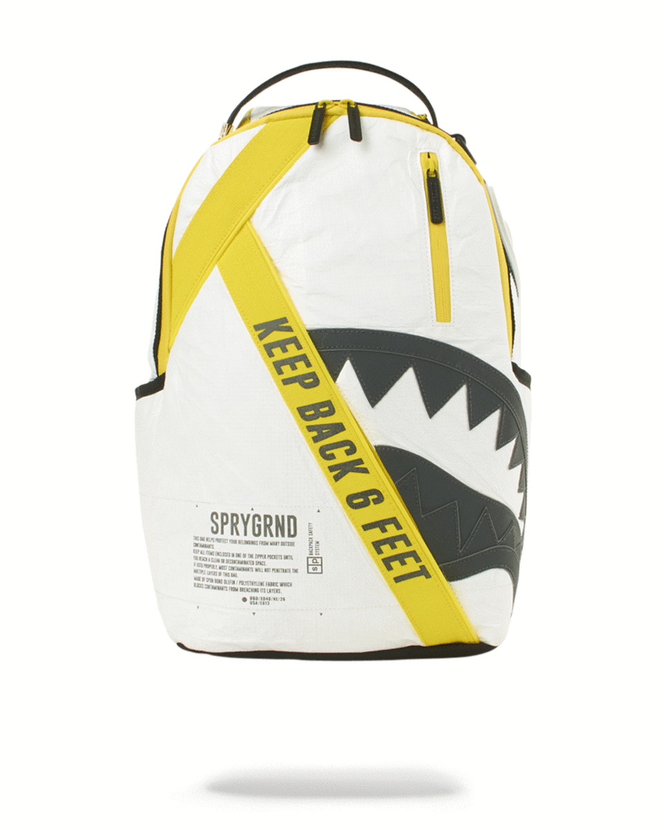 Front view of the pink Sprayground backpack showcasing its shark design and pockets.