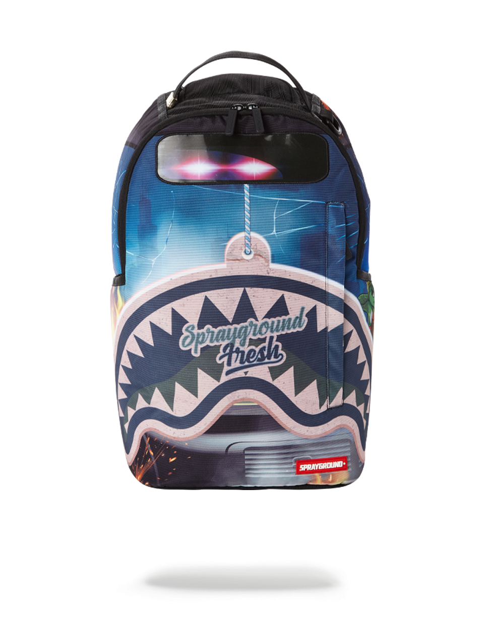 Sprayground designer backpack worn by a traveler in an urban setting
