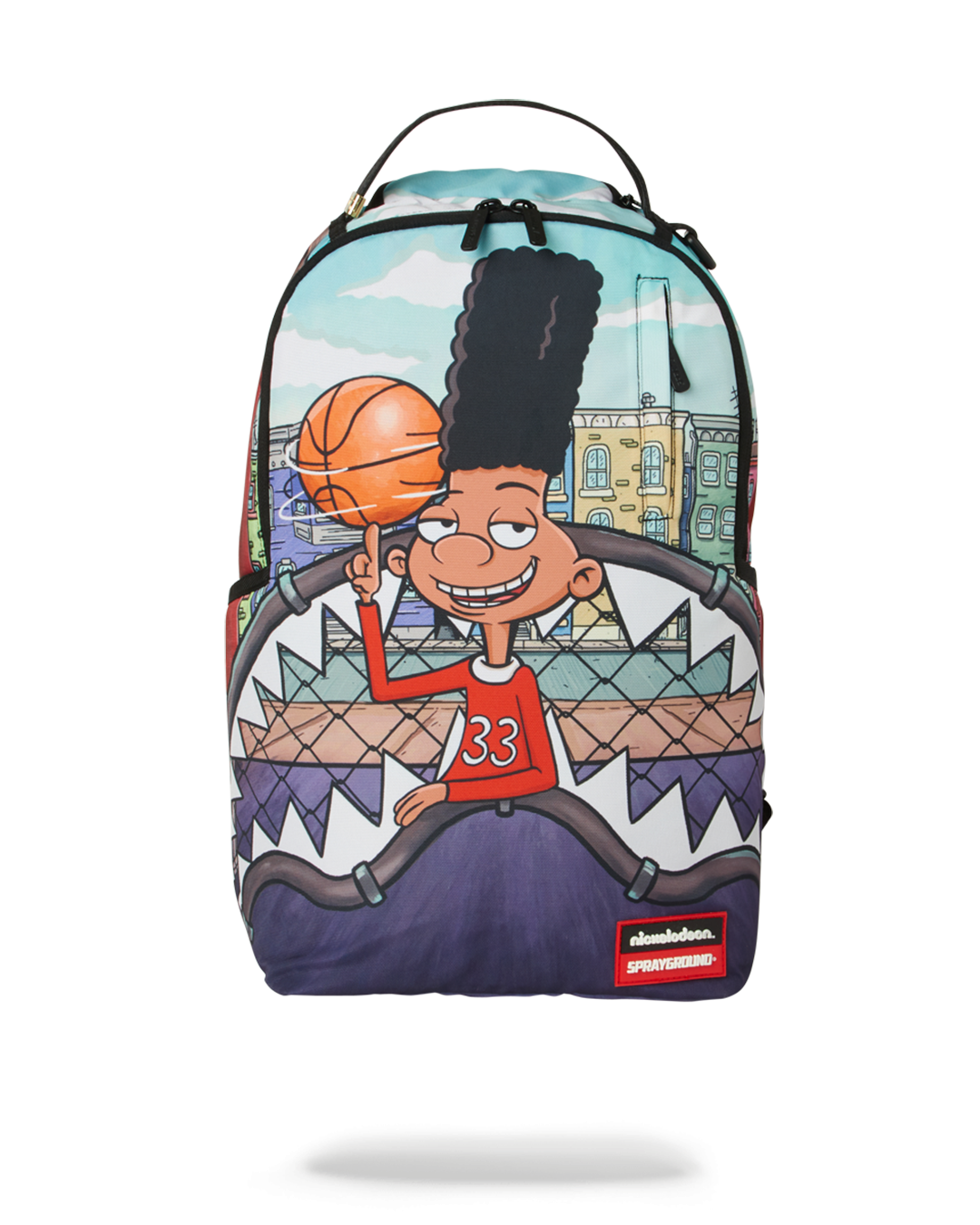 Side profile of the kids backpack showing the shark graphic and side pockets