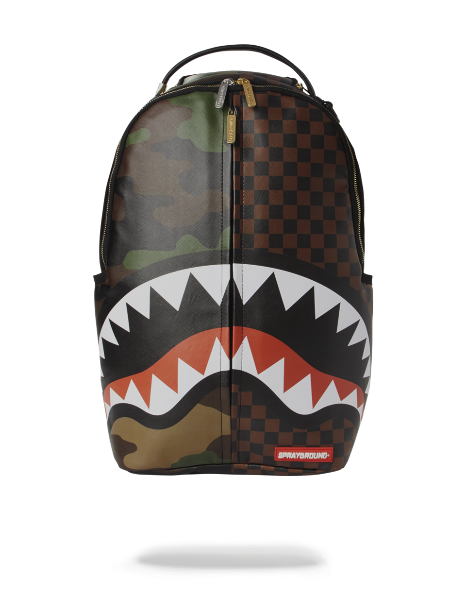 Front view of stylish Jungle Luxe travel backpack against urban skyline