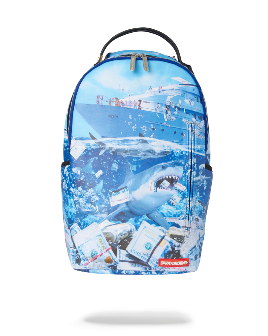 Shark Party Backpack DLXV worn casually over one shoulder in an urban setting