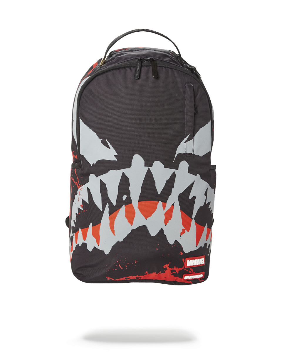 Close-up of the pink sprayground backpack with shark logo and water-resistant fabric