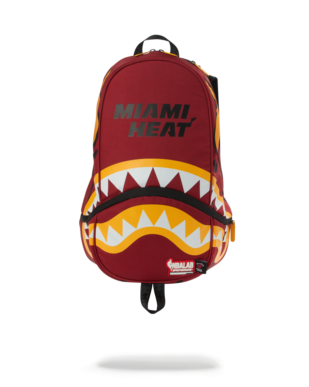 Close-up of the NBA backpack with Miami Heat colors and yellow zippers