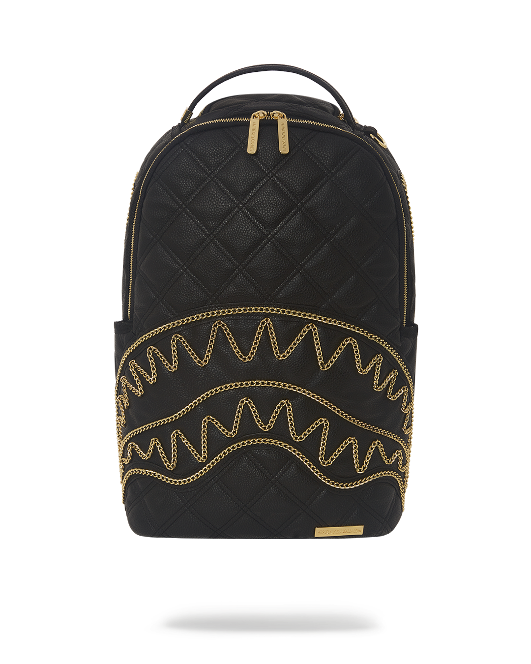 Close-up of diamond-quilted vegan leather and gold zippers on backpack