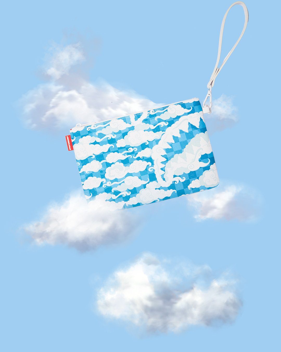 Front view of black evening bag with handle, styled against a California sunset backdrop