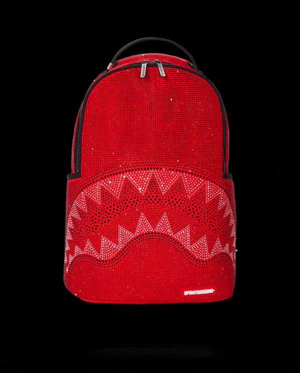 Rouge Trinity backpack worn crossbody, showcasing side pockets and minimalist design