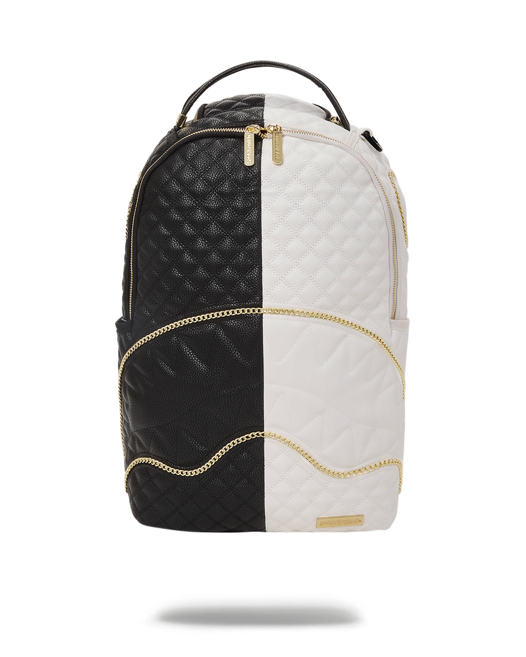 Close-up of quilted diamond stitching and gold shark mouth accents on backpack