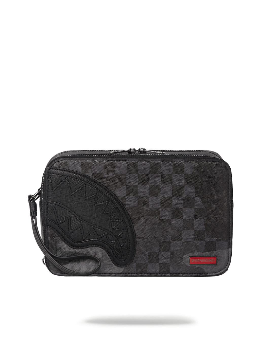 Men's leather toiletry bag laid flat with compartments unzipped