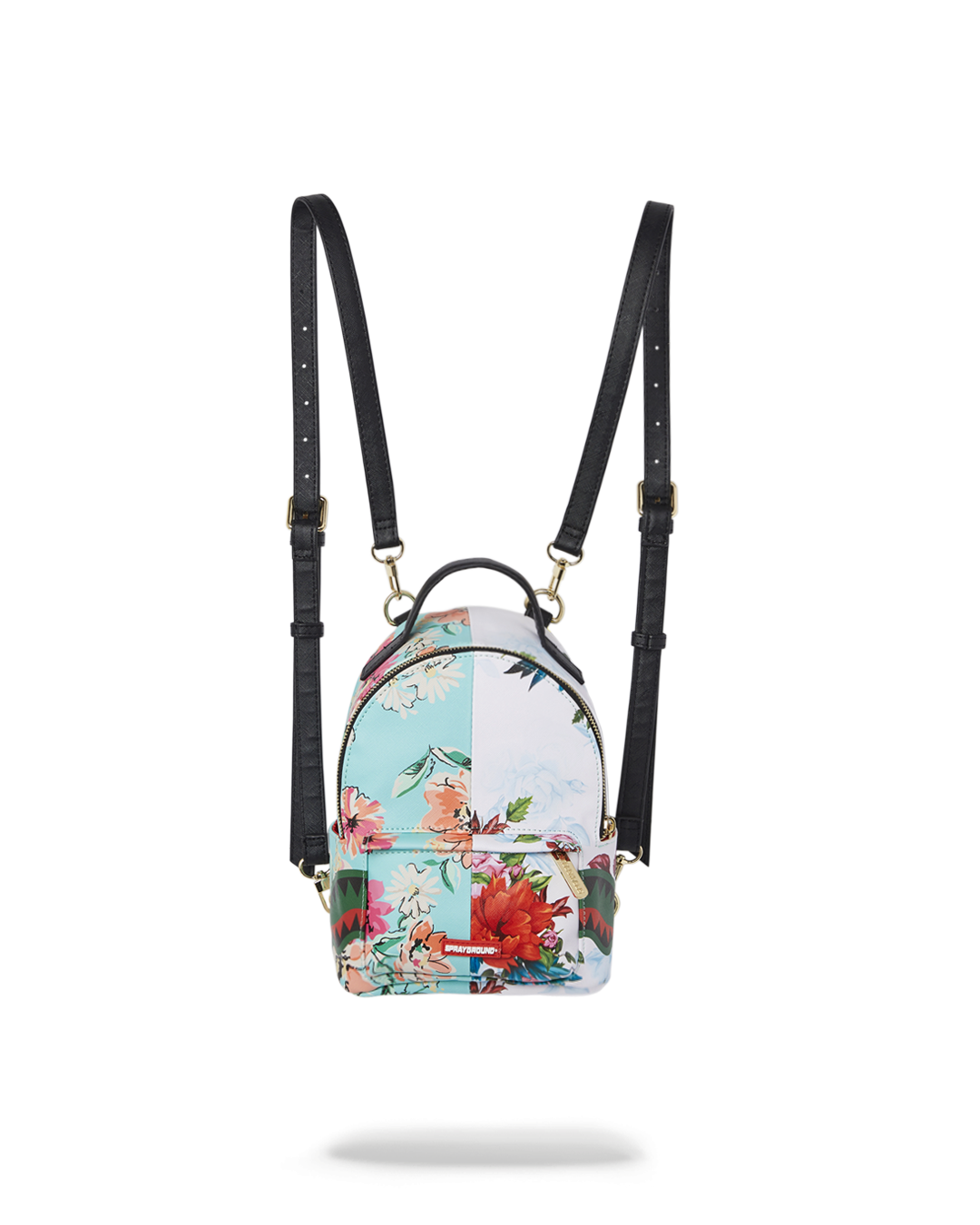 Sanctuary Quattro vegan leather backpack worn crossbody in a city setting