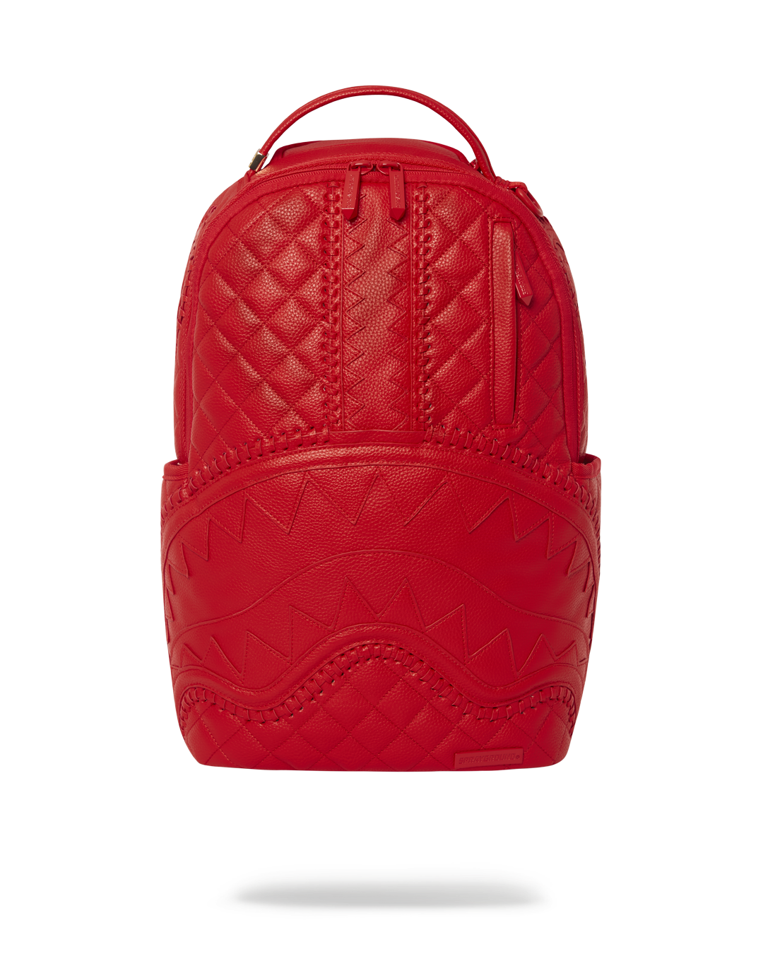 Red vegan leather backpack open showing laptop compartment