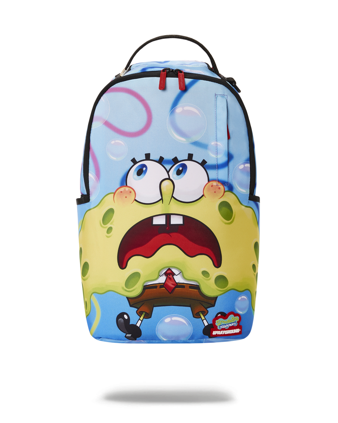 Front angle view of DLXR Sprayground backpack with shark shape and Spongebob detail