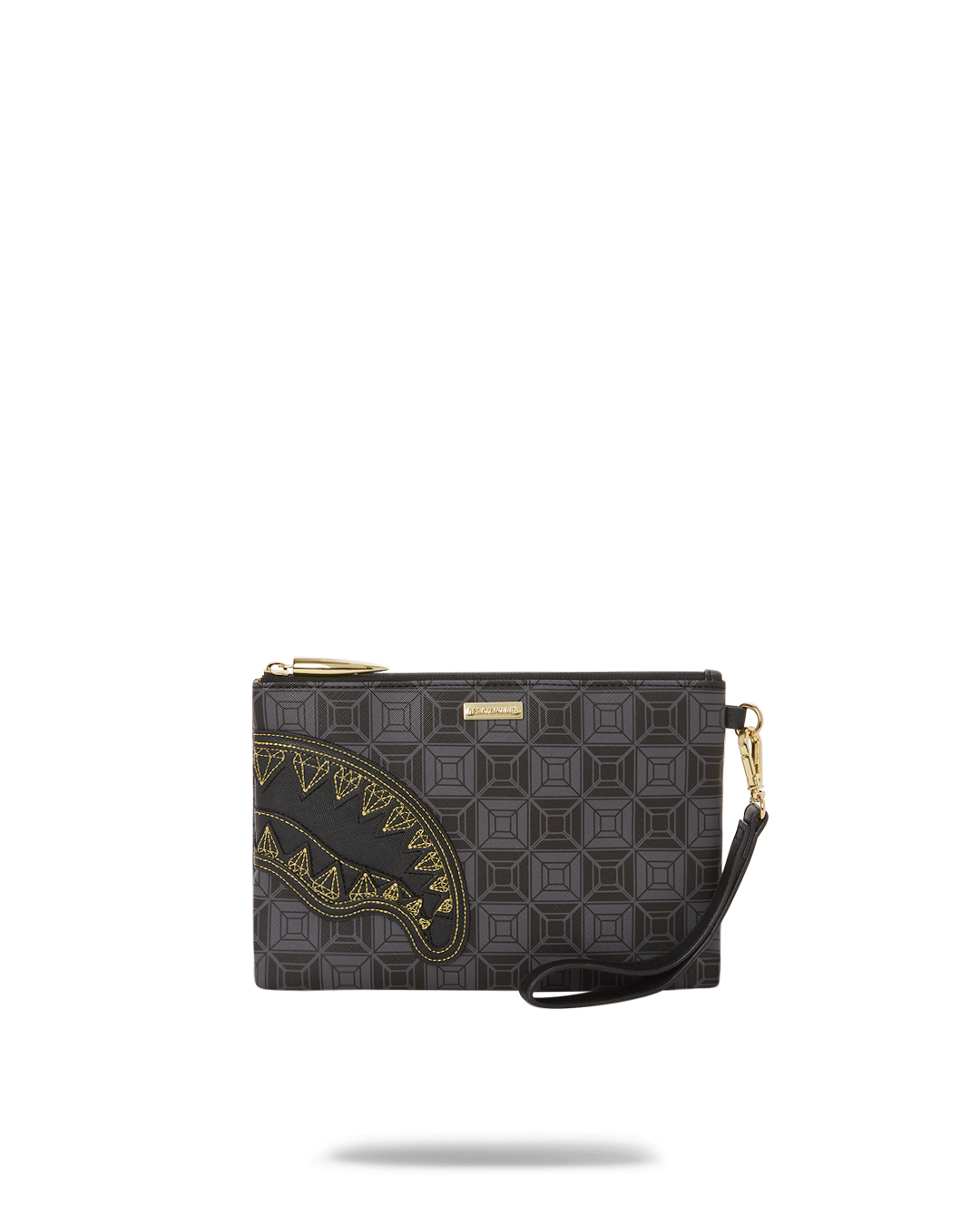 Anna Foldover Clutch in faux leather, held as a wristlet