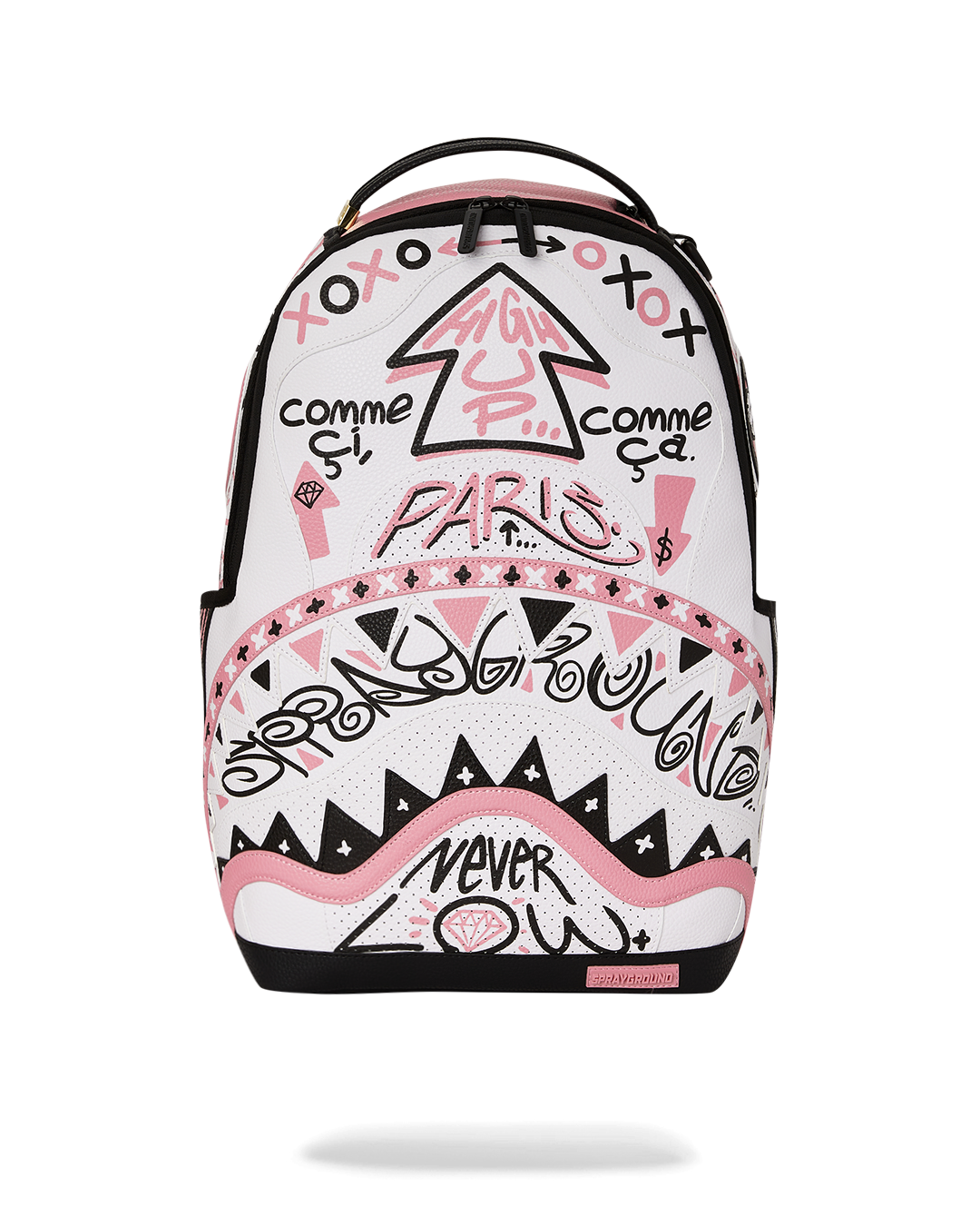Stylish faux leather backpack shown on a desk with a laptop and accessories