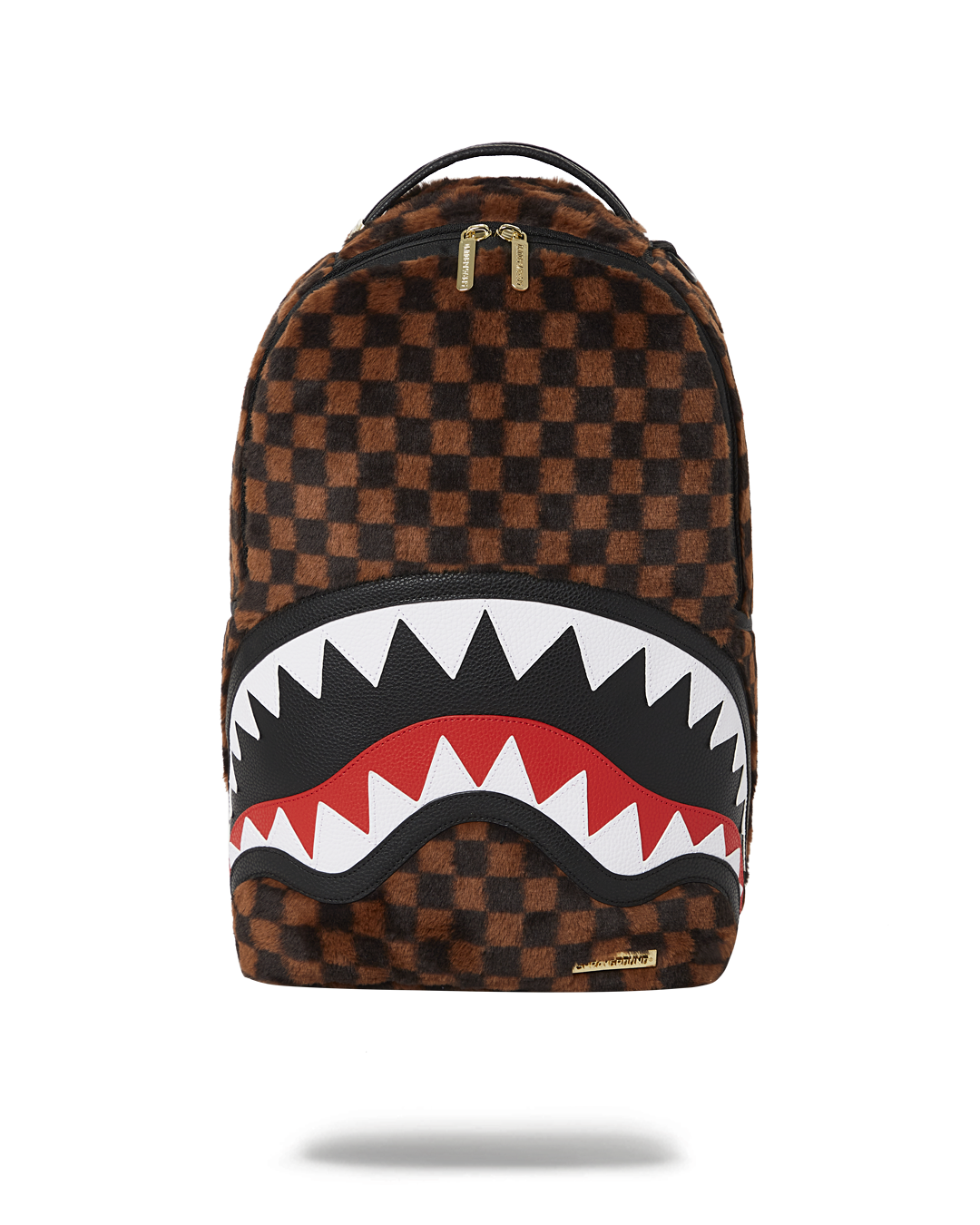 Detailed view of faux fur shark backpack showing front zipper pocket and gold zippers.