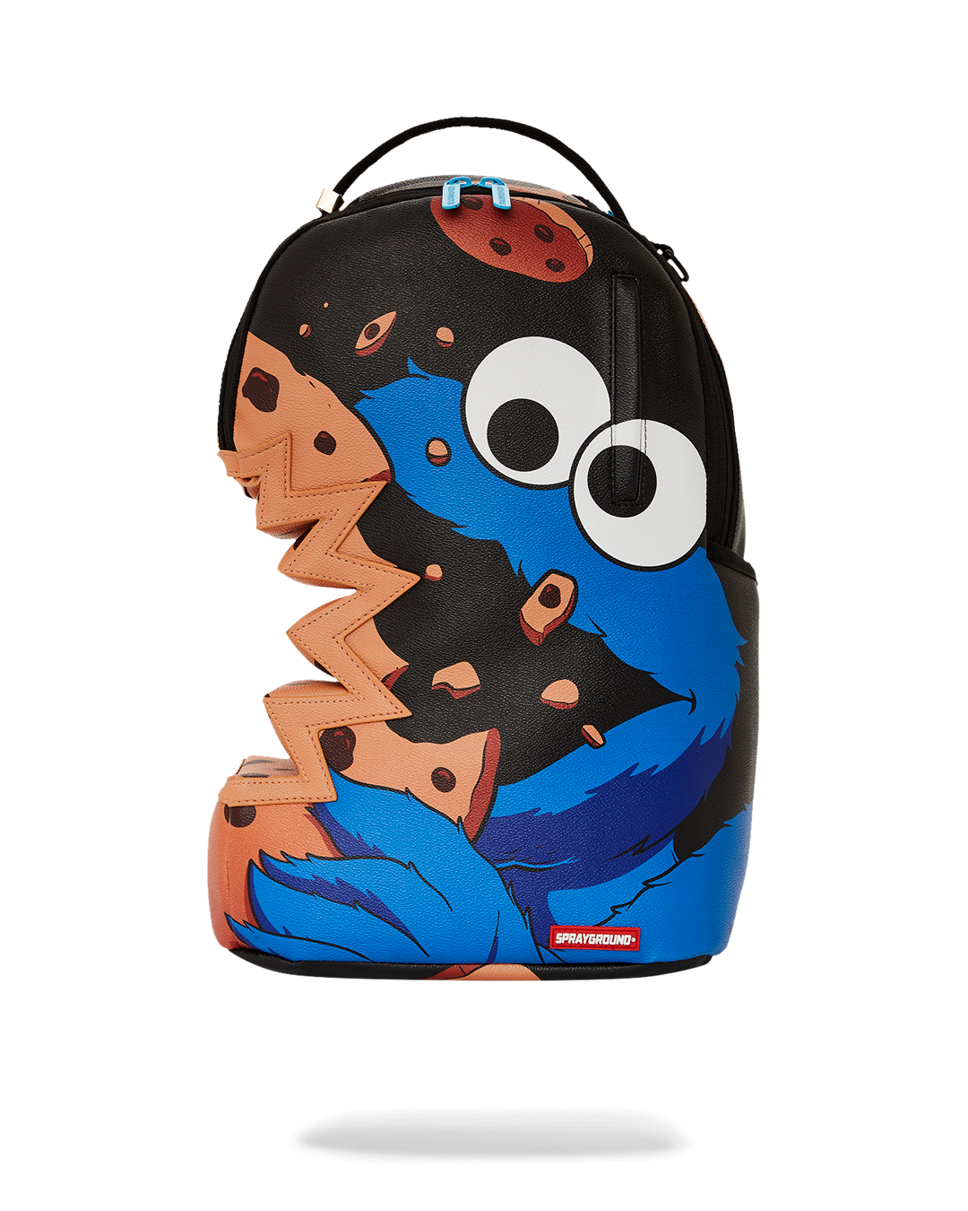 Cookie Monster Sharkbite backpack worn crossbody in urban setting